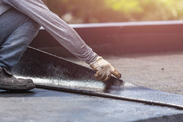 Professional Basement Waterproofing technician working in Bismarck, IL